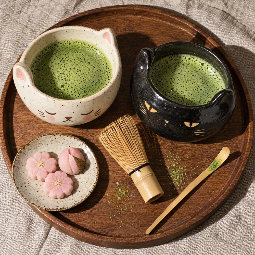 Shiro and Kuro side by side on a wooden tray